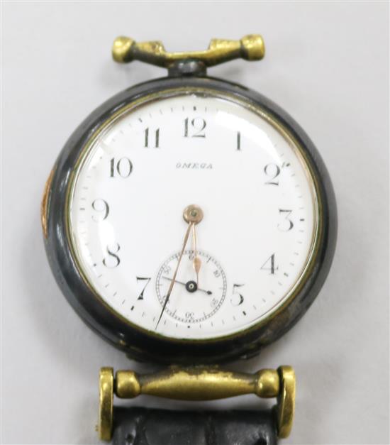 A gentlemans early 20th century gun metal Omega manual wind wrist watch, case numbered 3946677, (converted fob watch?)